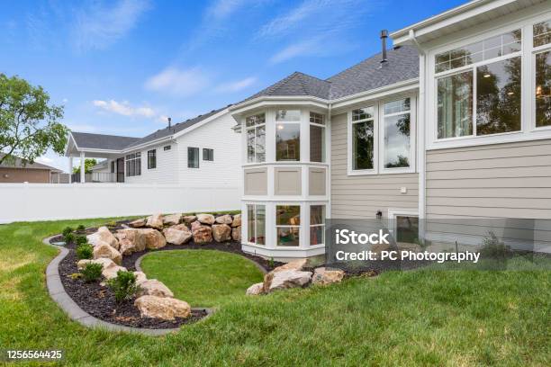 Rear Exterior And Back Yard Of New Home Stock Photo - Download Image Now - Siding - Building Feature, House, Landscaped