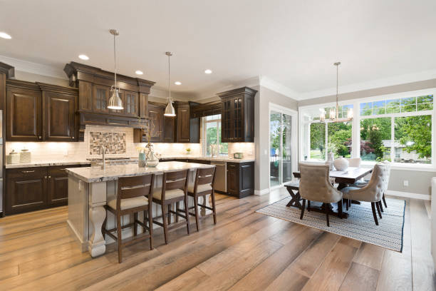 istock Dark brown gourmet kitchen with island 1256564429
