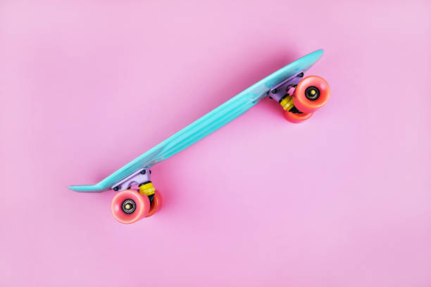 istock Sport inspired flatlay with turquoise penny skateboard 1256564713
