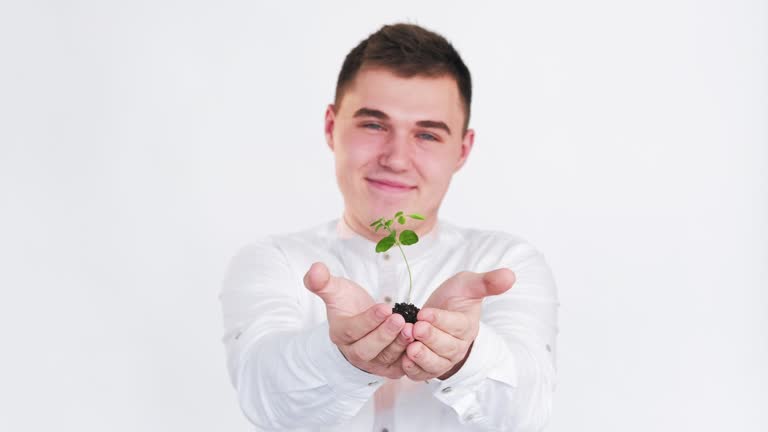 plant in hands sustainable earth guy sprout white