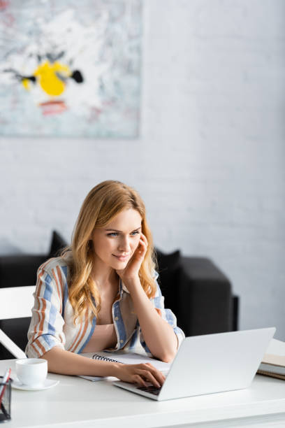 istock Selective focus of concentrated woman during working day 1256567230