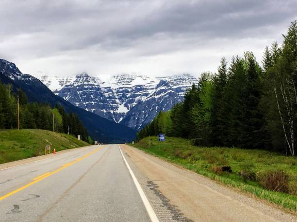istock An empty highway road heading through the rocky mountains in jasper national park, alberta, canada 1256569862