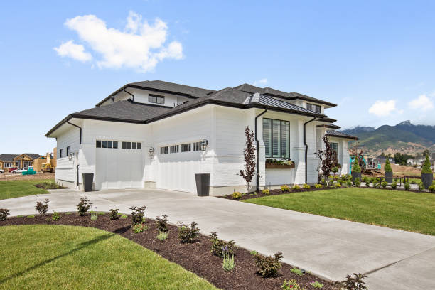 istock Front exterior of newly constructed modern home with many quality windows 1256570276