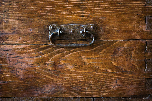 Antique key in a cabinet drawer. Find the right key for the lock. Concept and idea on the theme of security, history, protection, protection, mystery, conservation, etc. Retro style.