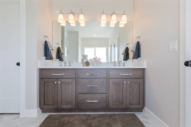 istock Double sinks and two handle faucets in a bright and cheery bathroom 1256571469