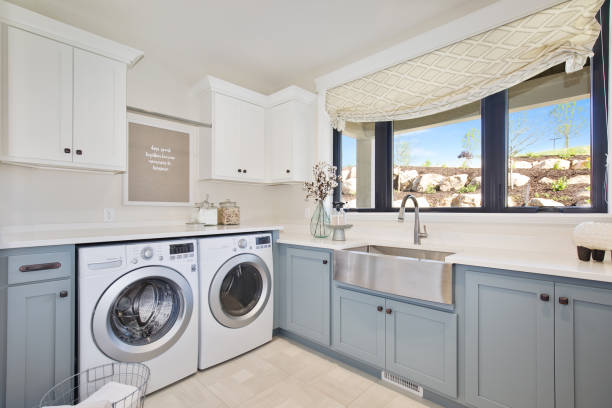 istock Large utility room with basin sink and front loading washing machine and dryer 1256574535