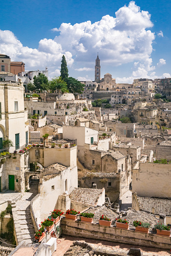 Wide image of Matera (Italy) under a cloudy summer sky