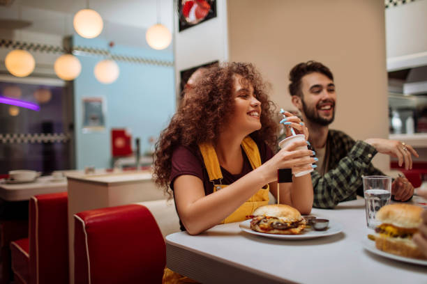 istock Getting together for a fast food dinner 1256574950