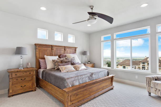 istock Luxurious new bedroom with large oversized windows 1256575624