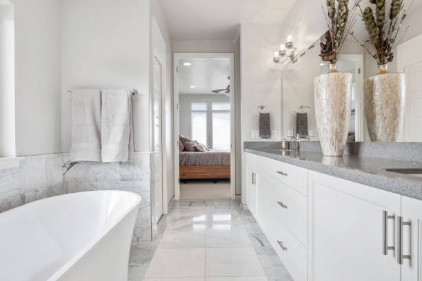 Beautiful and luxurious bathroom with free standing tub Simple gray and white colors bring the brightness and cleanliness to the forefront bathroom photos stock pictures, royalty-free photos & images