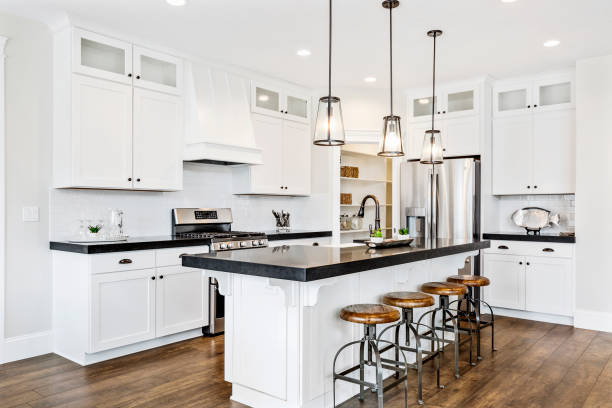 istock White gourmet kitchen with black countertops 1256575993