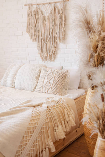 Bright boho style bedroom with macrame decor. Bright boho style bedroom with macrame decor. macrame photos stock pictures, royalty-free photos & images