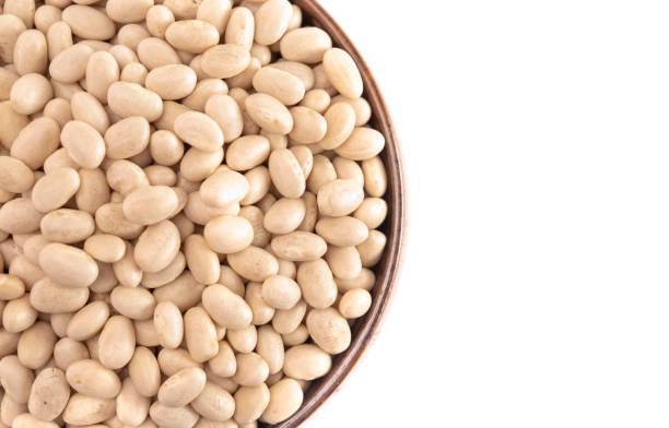 istock A Bowl of Dry Navy Beans Isolated on a White Background 1256579129