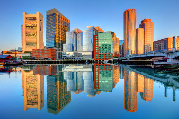 Boston Skyline Reflection Boston is known for its central role in American history, world-class educational institutions, cultural facilities, and champion sports franchises boston harbor stock pictures, royalty-free photos & images