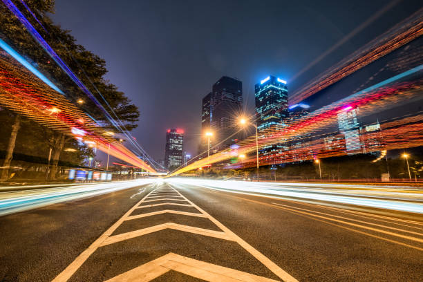 istock Vehicle light trails in city at night 1256590921