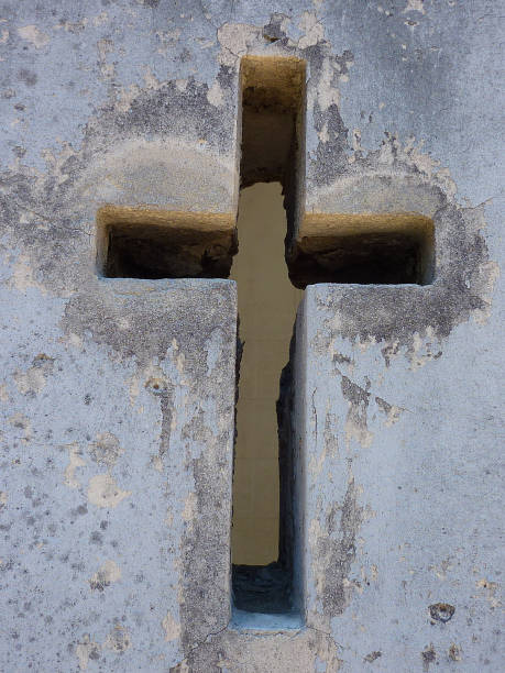 istock Hollow-out cross on a mausoleum 1256592022