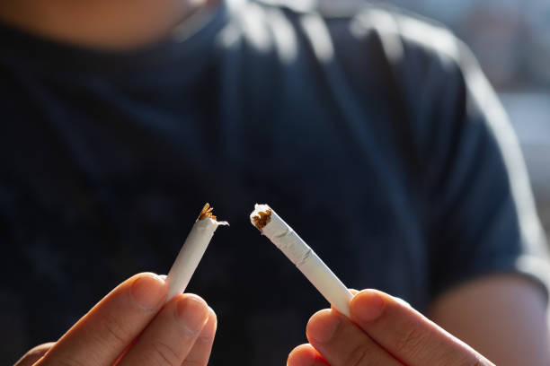 istock The fingers of man breaking a cigarette 1256593179