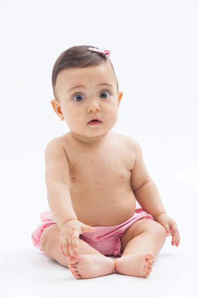 istock baby expressing surprise on a white background. 1256594827