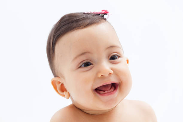 istock beautiful happy smiling baby on white background 1256594836
