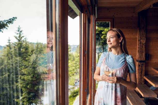istock Young woman enjoying wine 1256602232