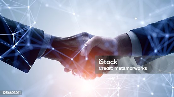 istock Business network concept. Customer support. Shaking hands. 1256603011