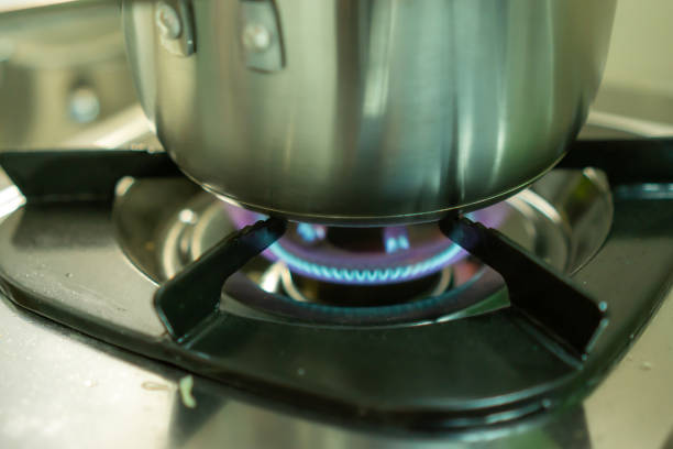 istock Pot heated by gas stove 1256610282