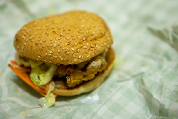 istock Chicken Burger on Wrapping Paper 1256610446