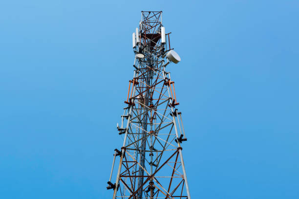istock Mobile telecommunication tower or cell tower with antennae with clear blue sky 1256612679