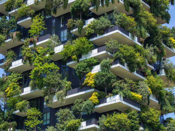 Milano, Italy. Bosco Verticale, a close up view at the modern and ecological skyscrapers with many trees on each balcony. Modern architecture, vertical gardens, terraces with plants stock photo