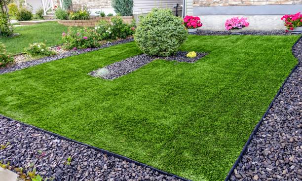 istock A beautiful artificial lawn in the front yard with nice flowers and shrubs surrounding it 1256614861