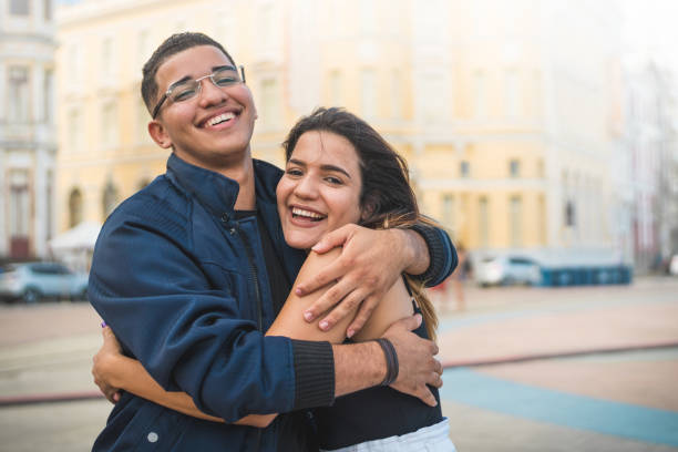 istock Friends hugging outdoors 1256614905