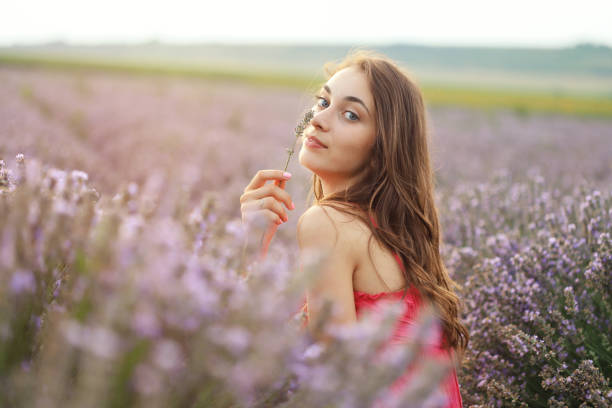 istock Young girl in lavender field 1256616074