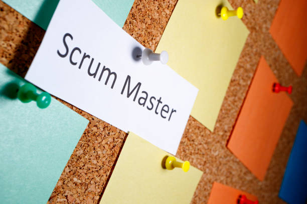 Scrum master is written on a piece of paper which on a bun is attached to a board Scrum master is written on a piece of paper which on a bun is attached to a board. outgoing perspective view scrum stock pictures, royalty-free photos & images