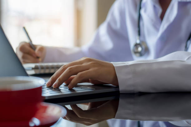 istock Female doctor work on laptop computer 1256618045