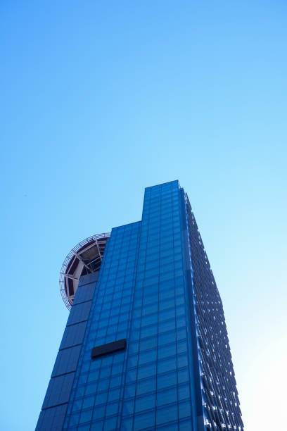 istock Corporate buildings and reflection of clouds 1256618823