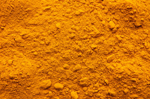 ウコンパウダーの背景 - spice ayurveda herb curry powder ストックフォトと画像