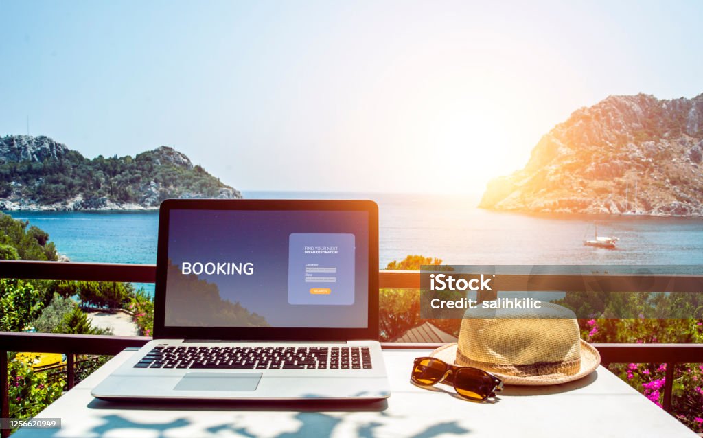 Travel booking web page concept. Booking on the internet. Travel booking web page concept. Booking on the internet. Laptop mock-up with sea view Making a Reservation Stock Photo