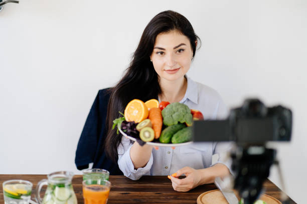 istock Nutritionist blogger recording new video 1256621108
