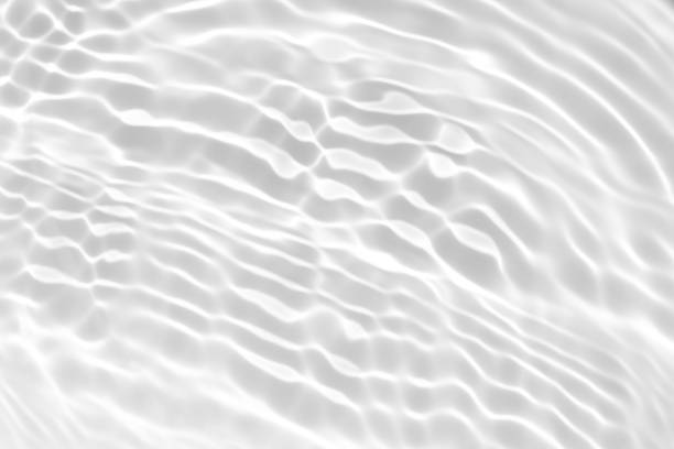 istock desaturated transparent clear calm water surface texture 1256628915