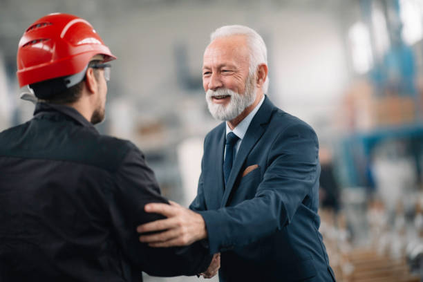istock Arhitect and worker in factory. 1256629072