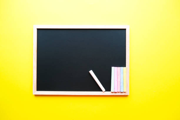 colored chalk on a dark school board on the yellow background. back to school concept. place for your text - blackboard back to school green picture frame imagens e fotografias de stock