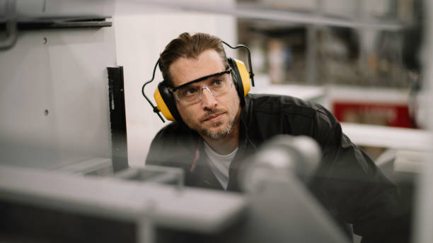 istock Young handsome factory worker. 1256629326