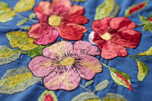 istock Embroidery with colorful flowers. Close up. 1256630347