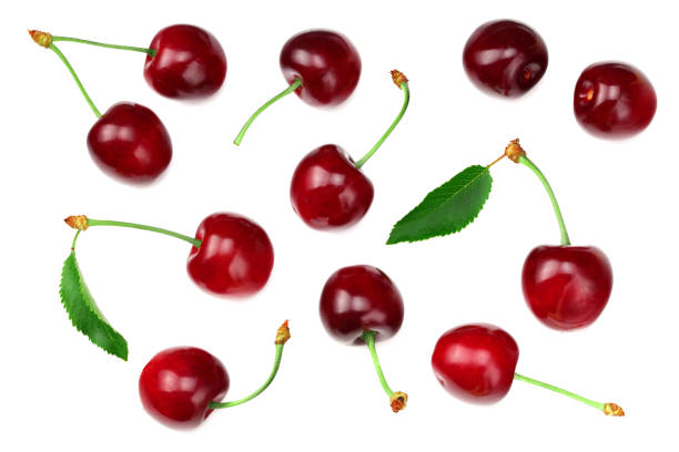 istock cherry with green leaf isolated on white background. Top view 1256631022