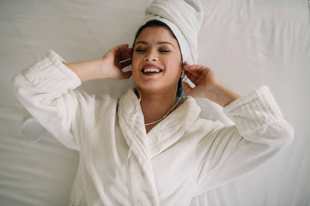 istock Beautiful young woman relaxing after bath 1256631029