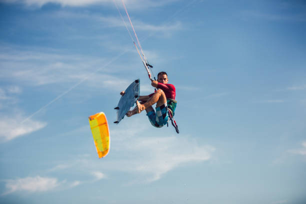 istock Professional kiter makes the difficult trick on a beautiful background. 1256631343