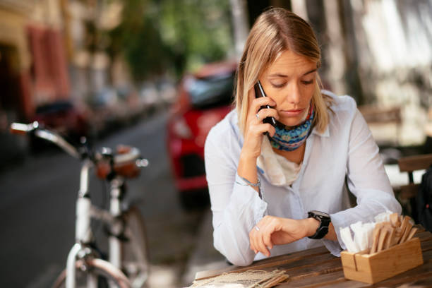 istock Beautiful woman drinking coffee in cafe. 1256632617