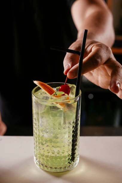 istock Expert barman making cocktail at nightclub. 1256633743