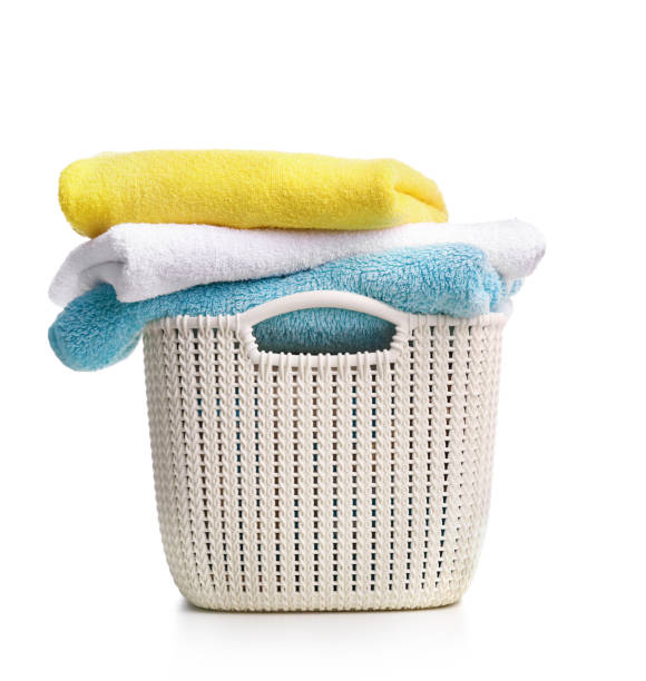 istock Detergent with washing powder and towels isolated on white 1256635329
