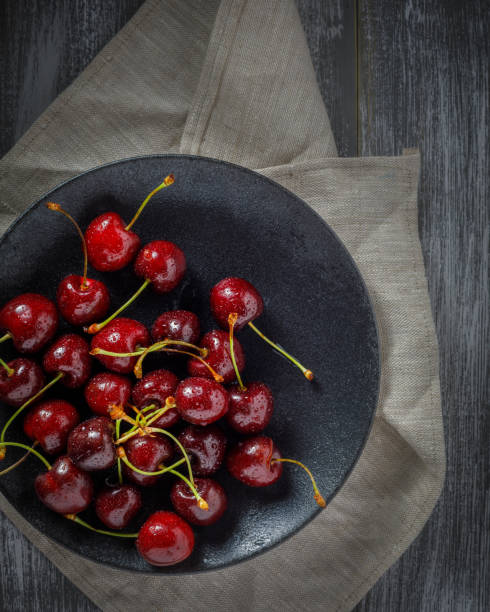 istock still life with cherries on a wooden table 1256636102